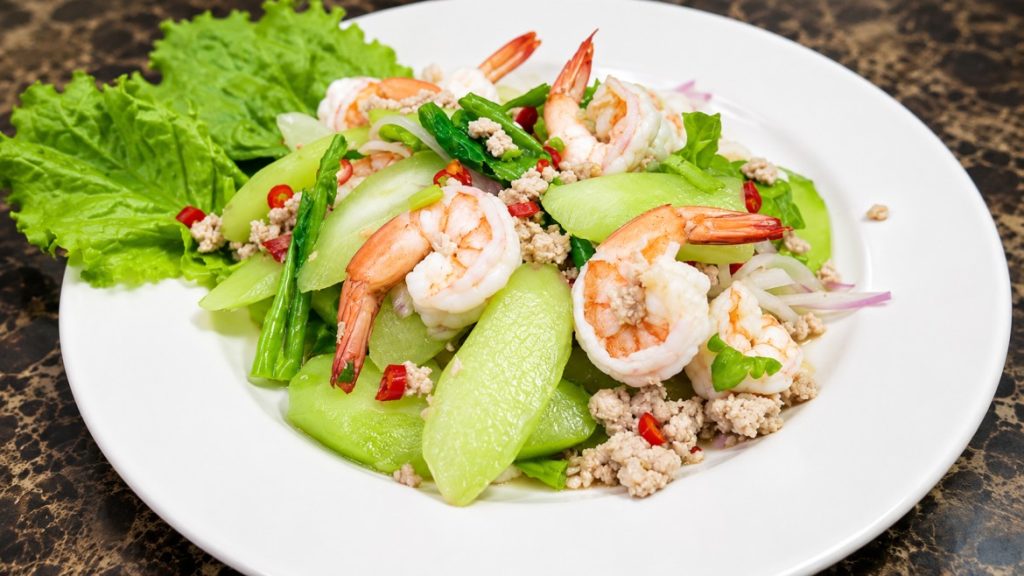 ยำก้านคะน้ากุ้งสสดใส่หมูสับ (Kale stem salad with fresh shrimp and pork)
